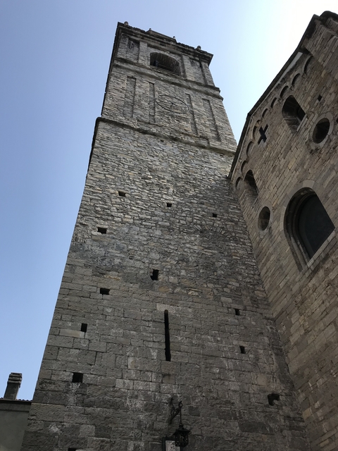 Stone fortress wall under a clear sky