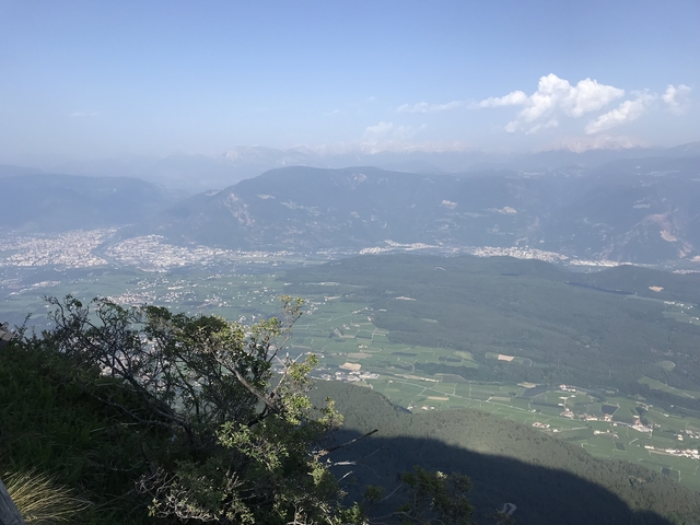 Aerial view of a green valley with mountains