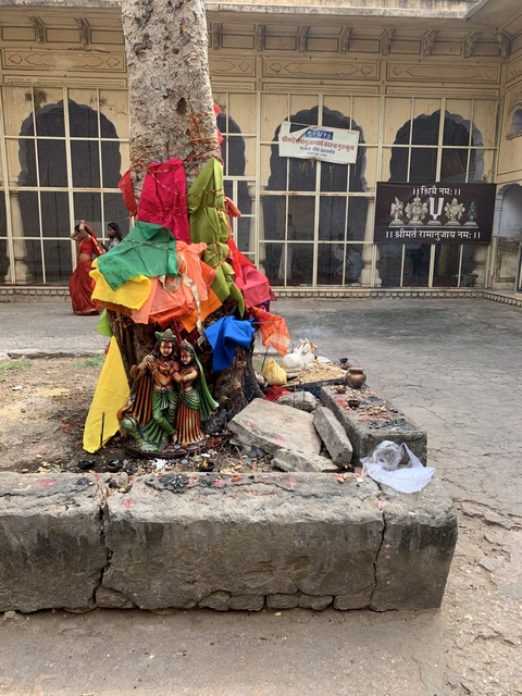       Colorful religious shrine with offerings.
  