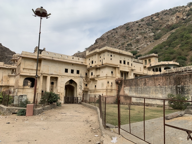       Old historical fort-like structure with hills.
  