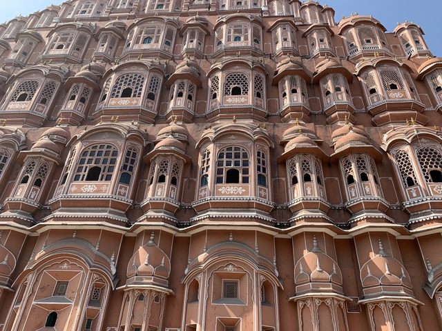       Facade of Hawa Mahal with detailed architectural design.
  