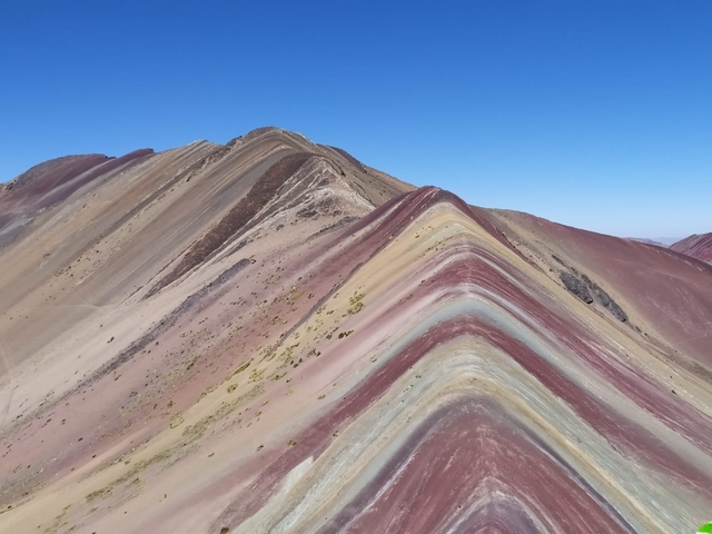      Vivid colors of Rainbow Mountain under clear skies
  