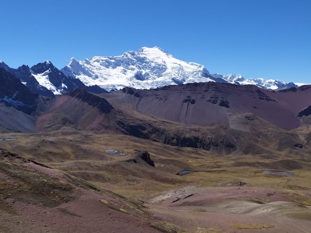       Snow-capped mountain range in the distance
  