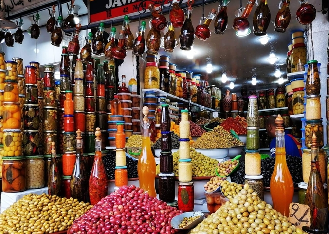       Colorful display of pickled goods in jars.
  