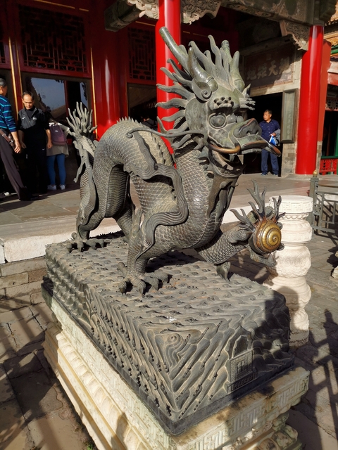       Intricate dragon sculpture in a public space.
  
