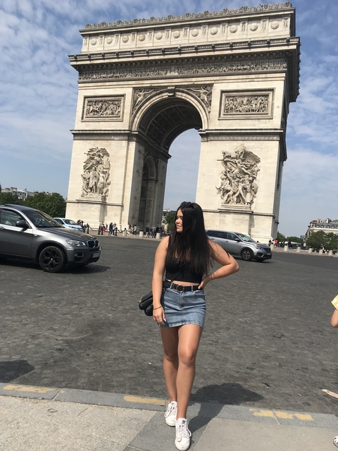       Person in front of the Arc de Triomphe in Paris.
  