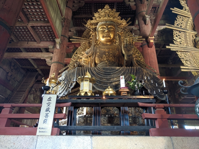 Golden temple statue inside a large hall