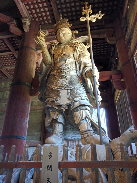 Intricately detailed stone statue inside a temple