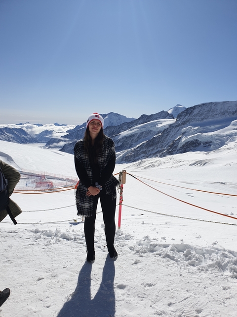 Person on a snowy mountain landscape.