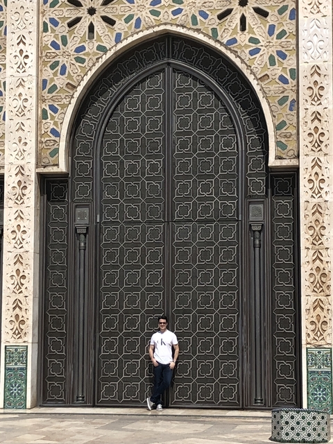       Decorative metal door with intricate patterns.
  