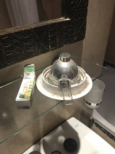       Close-up of a light fixture and a box.
  