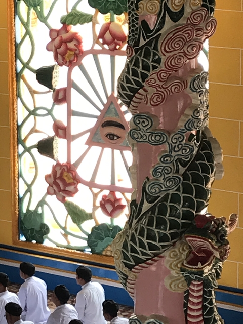 Decorative artwork with religious symbols and bright colors.