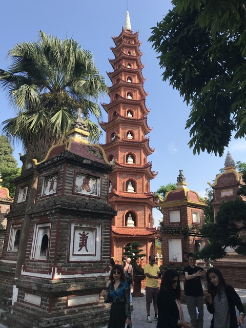 Pagoda with intricate architecture surrounded by trees.