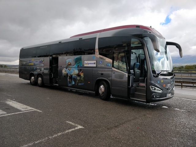       Tourist bus parked on the roadside.
  