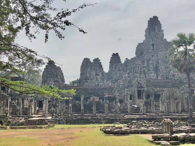       Ancient temple with multiple stone towers.
  