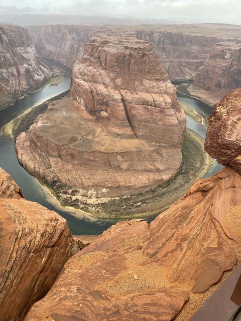 Large rock formation with river running through