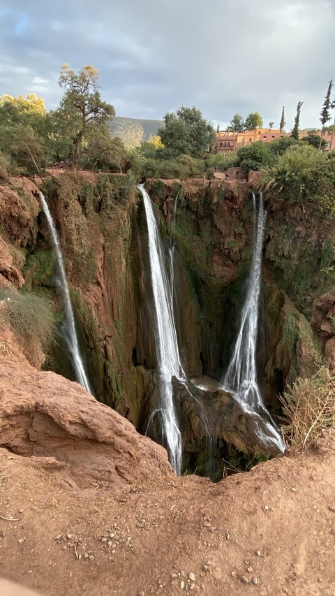       Majestic view of a waterfall cascading down a canyon.
  