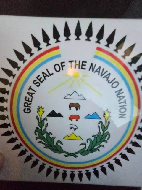 Seal of the Navajo Nation with geometric elements.