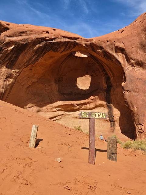 Red rock formation with 'Big Hogan' sign.
