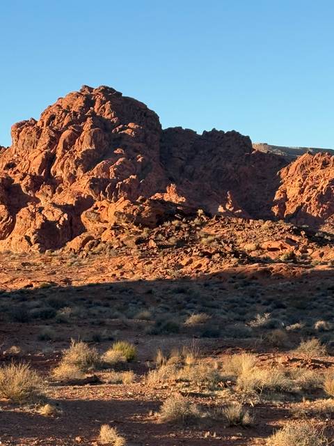 Red rock formations under a clear blue sky.