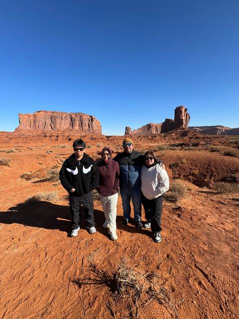 People posing in Monument Valley.
