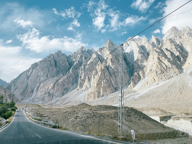       A scenic view of rugged mountains and road in Hunza Valley, Pakistan.
  