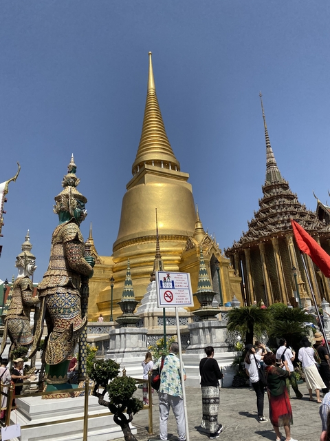 Golden stupas and traditional architecture with intricate details.