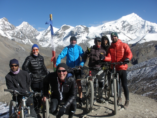 Group of cyclists at the Himalayas.