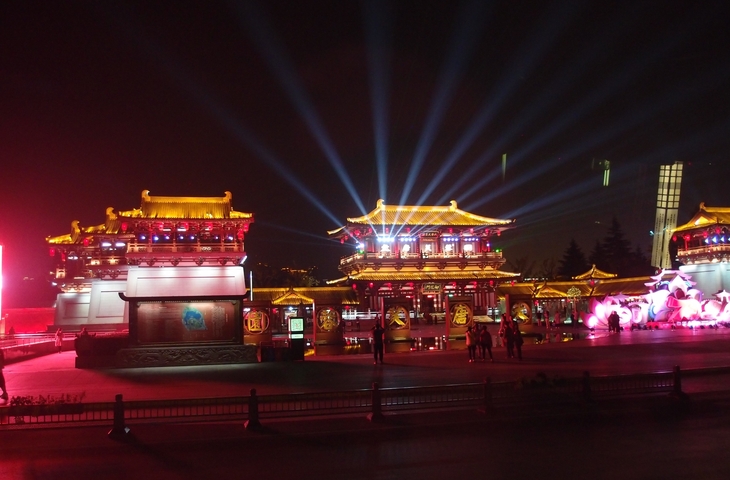Illuminated traditional Chinese architecture at night.