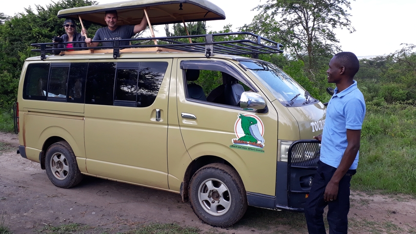 People in a safari van during an expedition.