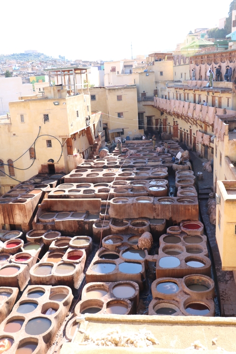 Tanneries with numerous vats in a Moroccan city.