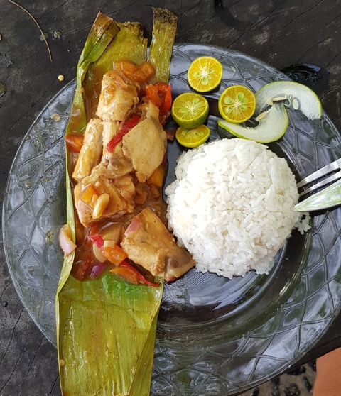       Plate of rice and dish with vegetables.
  