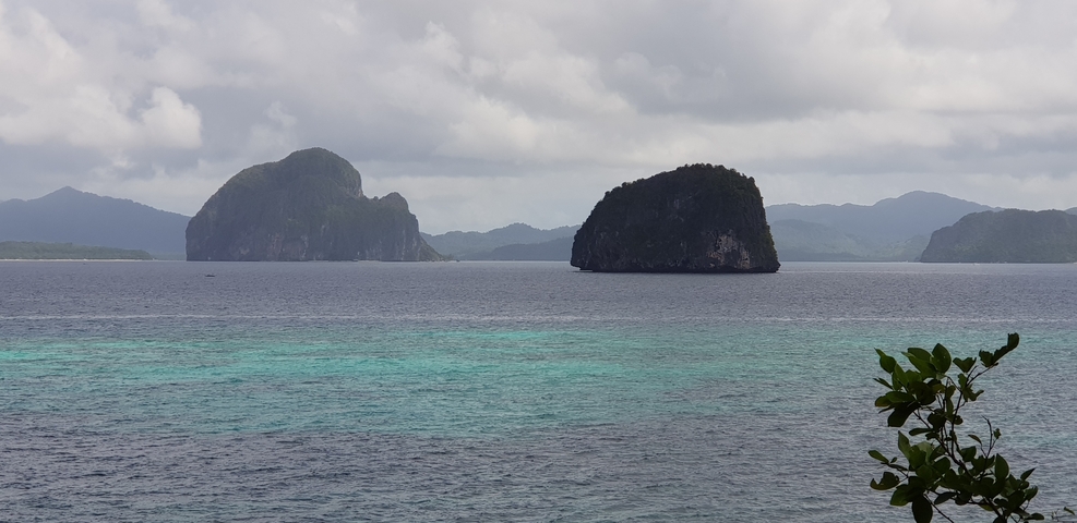       Island formations in calm sea waters.
  