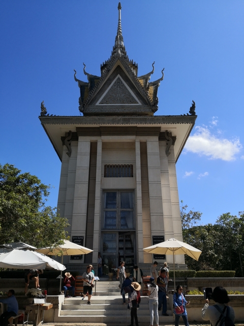       Memorial stupa with clear blue sky.
  