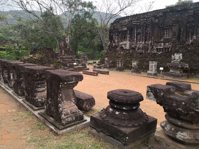       Ancient ruins with stone pedestals.
  