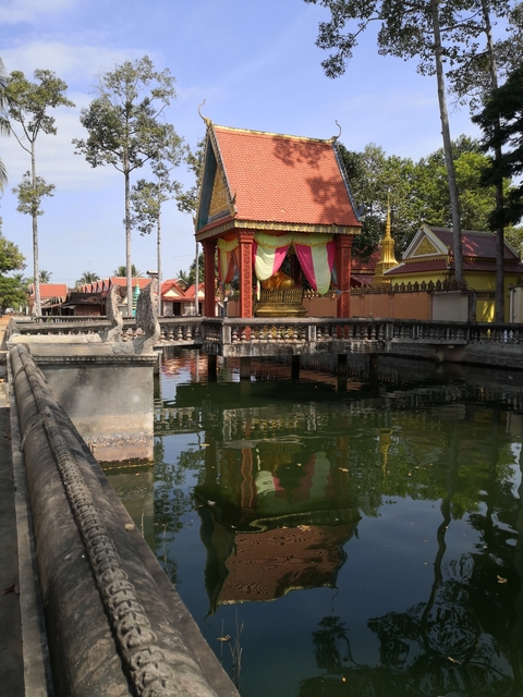 Decorative structures by a reflective pond.
