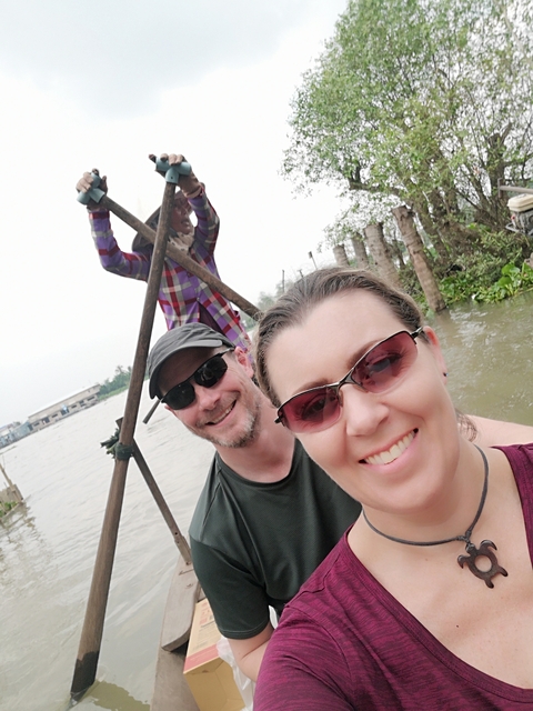       People on a boat enjoying a ride.
  