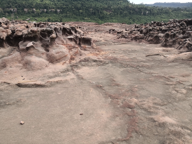       Rocky terrain with eroded stone formations.
  