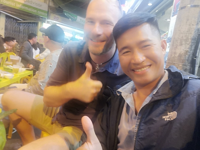       Blurry image of people in a social setting.
  