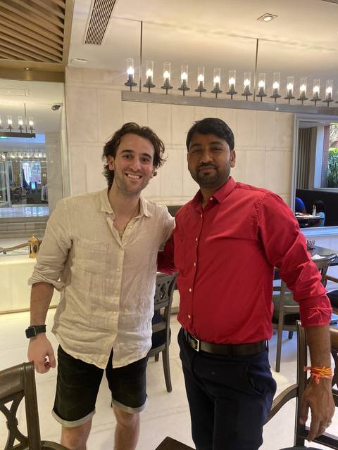 Two people posing together indoors.