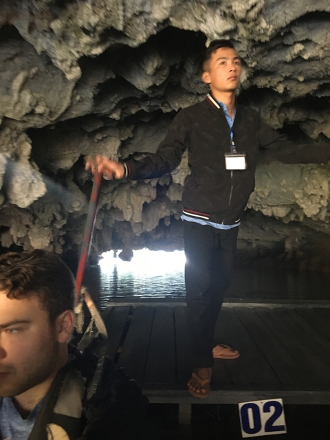       Guide leading a tour inside a cave.
  