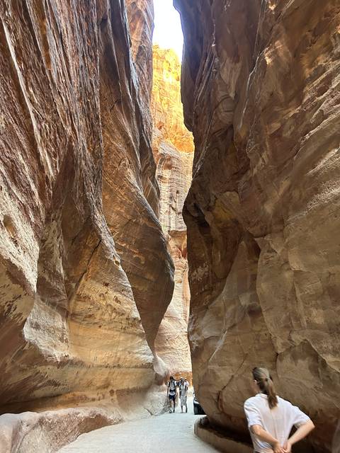 Narrow passageway through tall rocky cliffs.