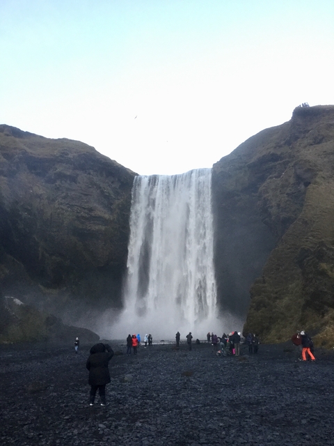 Waterfall cascading over a rocky cliff.