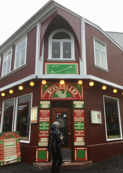 Entrance to a building with signage and lights.