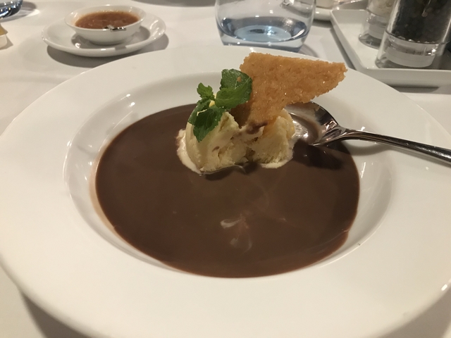       Dessert dish with chocolate and garnish in a white bowl.
  