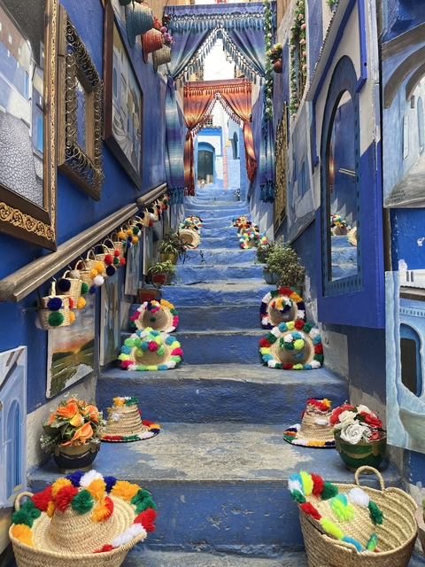 Blue-painted steps adorned with colorful decorations.