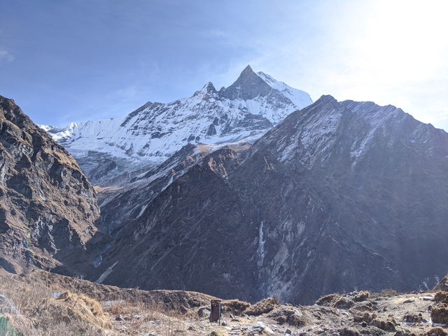 Snow-capped mountain peak with clear sky.