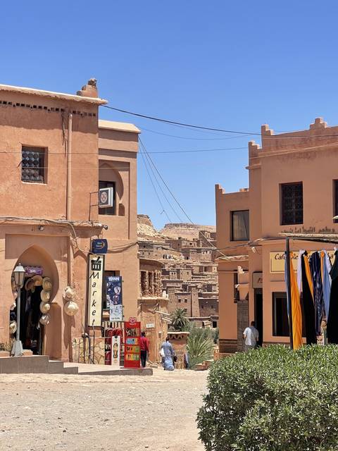       A bustling street in a traditional Moroccan neighborhood.
  