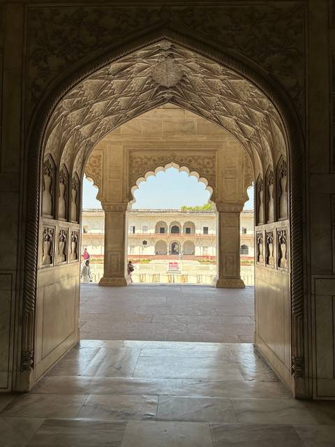       Intricately detailed archway leading to a courtyard.
  