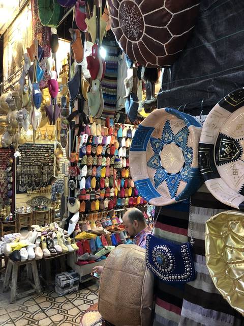       Colorful market stand displaying various items.
  